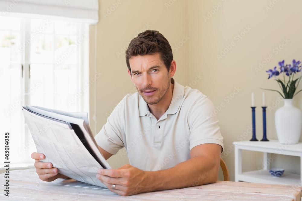 Portrait of a man reading newspaper Portrait of a man reading newspaper