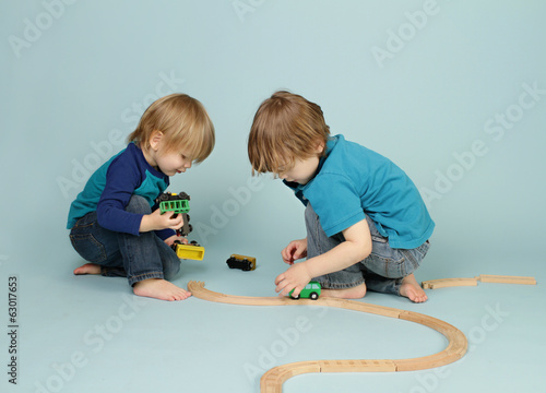 Kids playing with toy trains