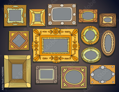 Group of picture frames on wall.