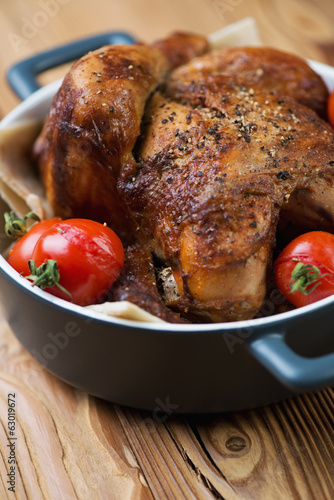 Close-up of baked spicy chicken, vertical shot