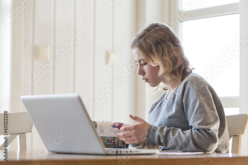 Young girl working on a laptop