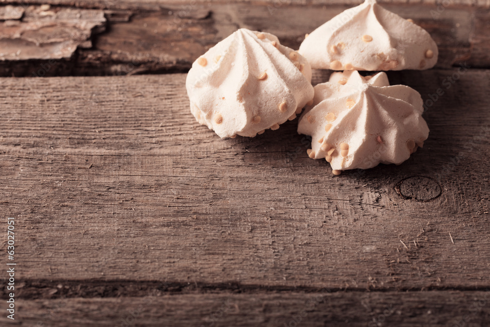 meringue cookies on wooden background meringue cookies on wooden background