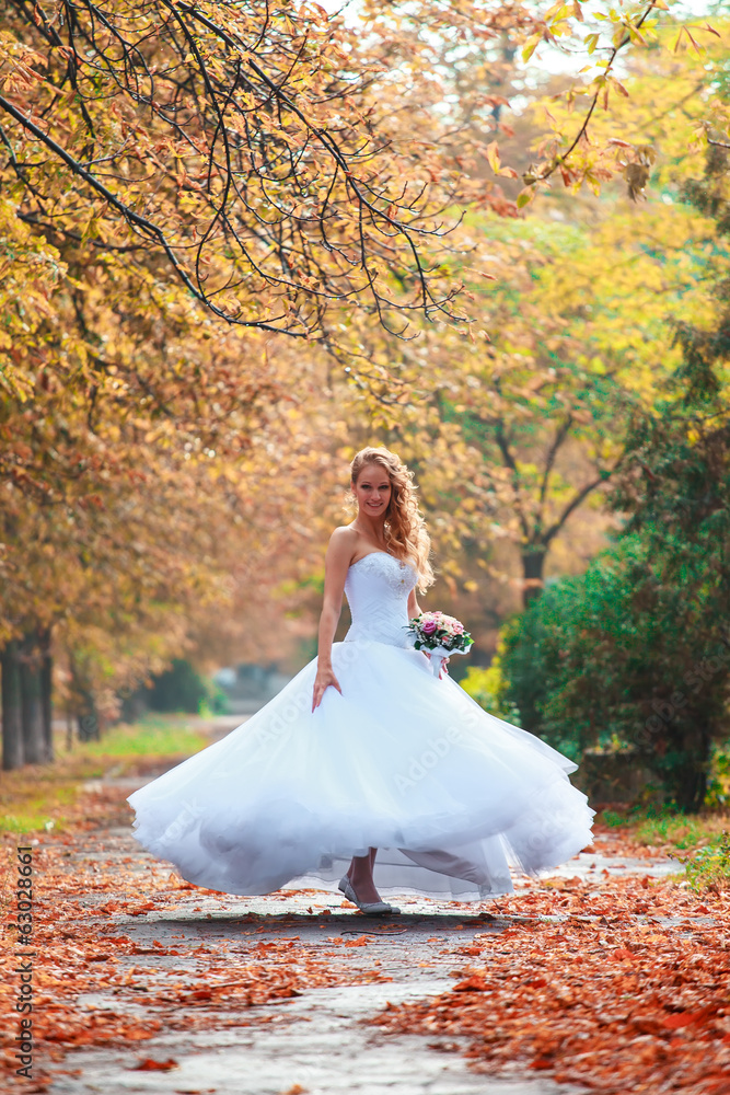 Fototapeta premium Beautiful bride outdoors in a forest.