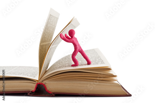 plasticine man leafing through a book