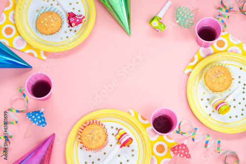Girl birthday pink table setting with party gadgets