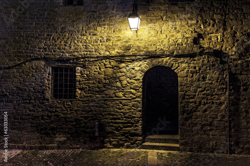 Fotografia, Obraz Dark street in an old village