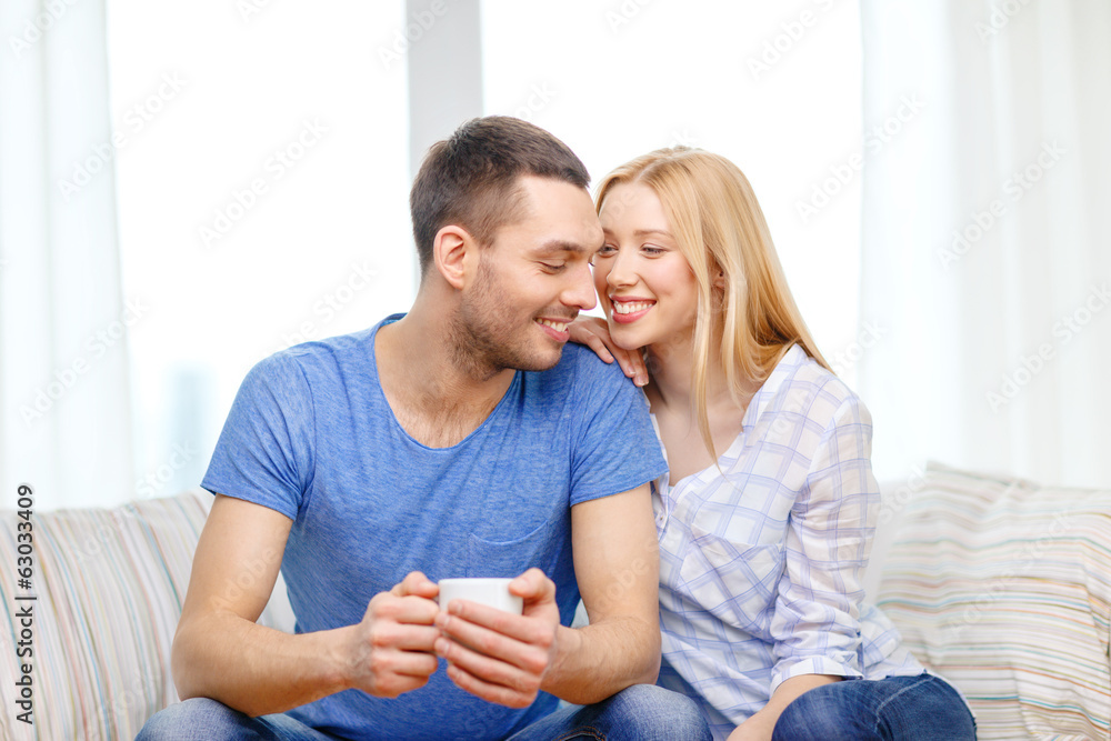 smiling man with cup of tea or coffee with wife smiling man with cup of tea or coffee with wife