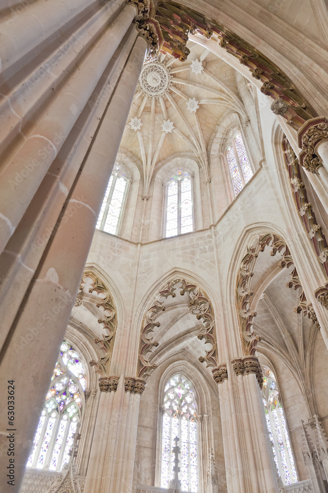 Batalha Monastery. Gothic style columns and ornate ceiling