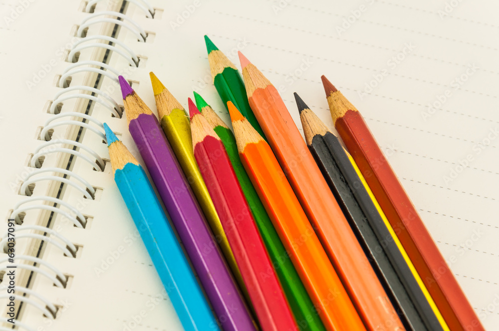 pencils on note book pencils on note book
