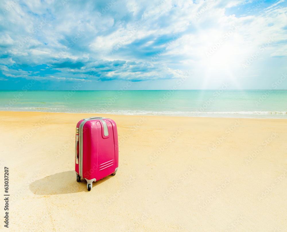 Suitcase at the sunny beach Suitcase at the sunny beach