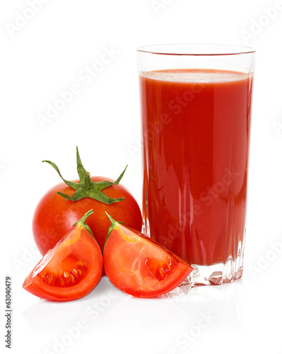 Obraz na płótnie Drinking glass with tomato juice and ripe fresh tomato