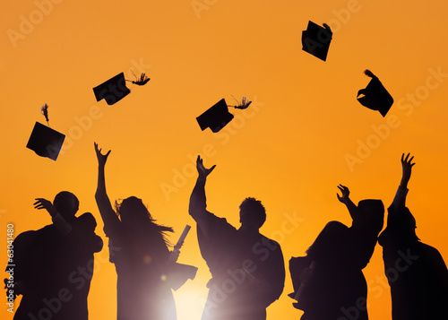 Graduating Students Throwing Caps In The Air