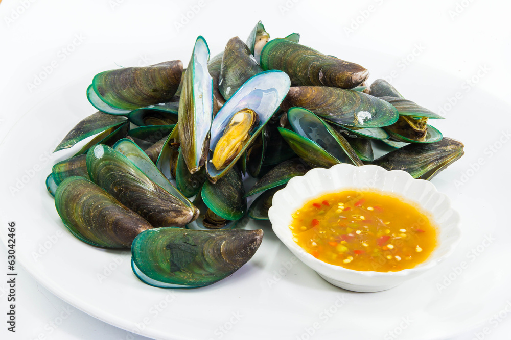 Steam mussel on white dish with seafood sauce
