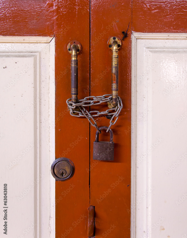 master key on wood door and key knob