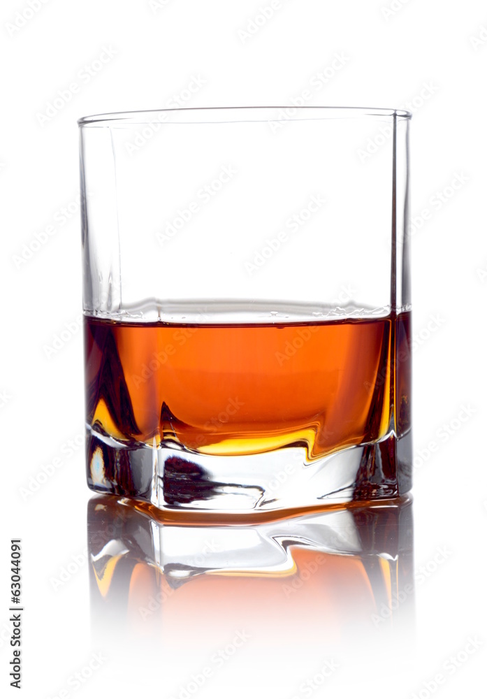 Whisky in a glass isolated on white Whisky in a glass isolated on white