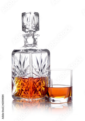 Whisky in a carafe and a glass isolated on white