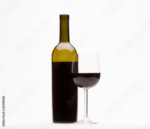 Red wine and wine glass isolated on white