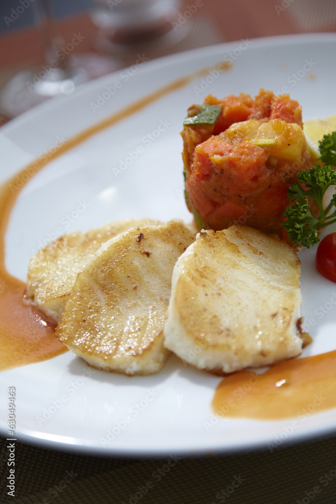 grill fish and tomato sauce in sun light grill fish and tomato sauce in sun light