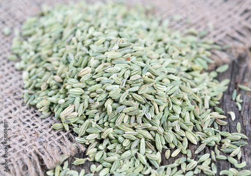 fennel seeds on wooden surface