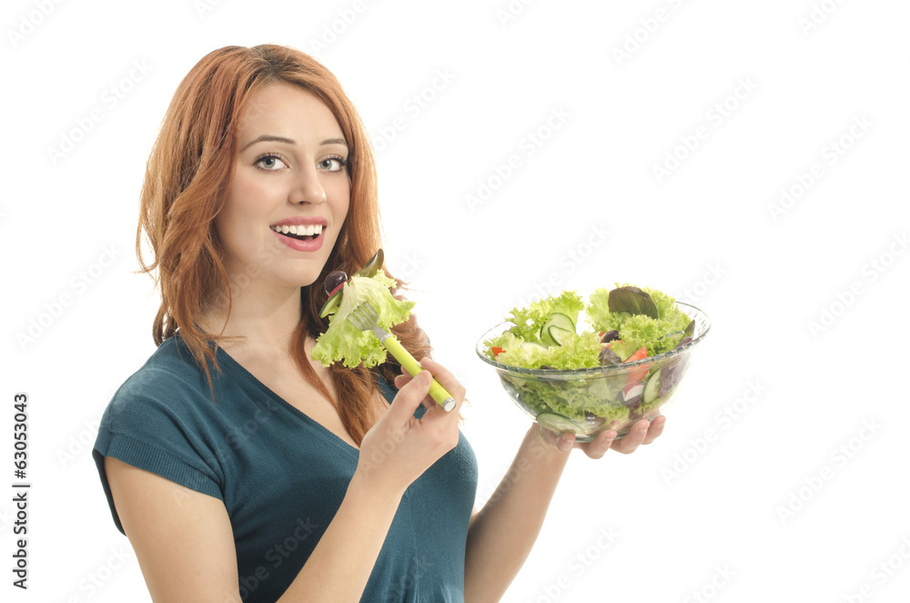 Happy woman eating organic salad. Woman keeping a diet Happy woman eating organic salad. Woman keeping a diet