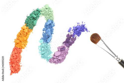 Fototapeta Naklejka Na Ścianę i Meble -  Rainbow crushed eyeshadow and professional make-up brush