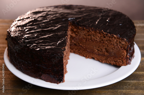 Delicious chocolate cake on table close-up photo