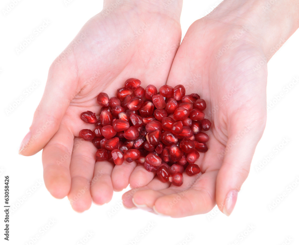 Ripe pomegranate in hands isolated on white Ripe pomegranate in hands isolated on white