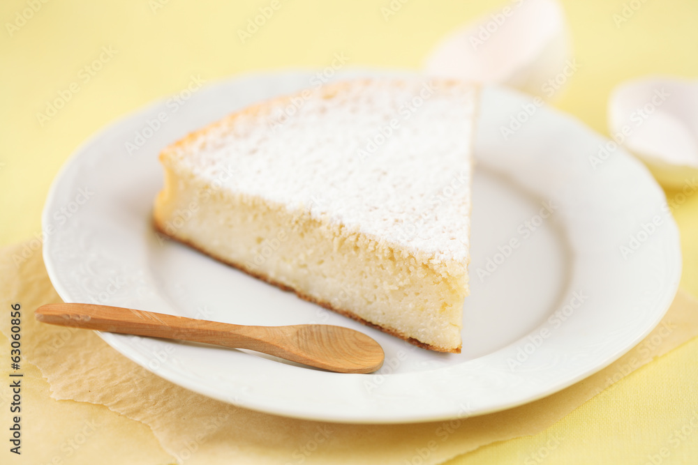Piece of Milk Cake on a white plate Piece of Milk Cake on a white plate