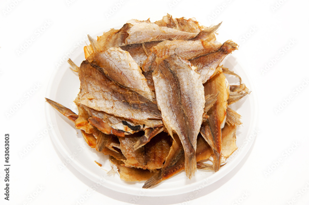 Dried fishes on a plate Dried fishes on a plate