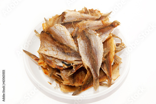 Dried fishes on a plate 