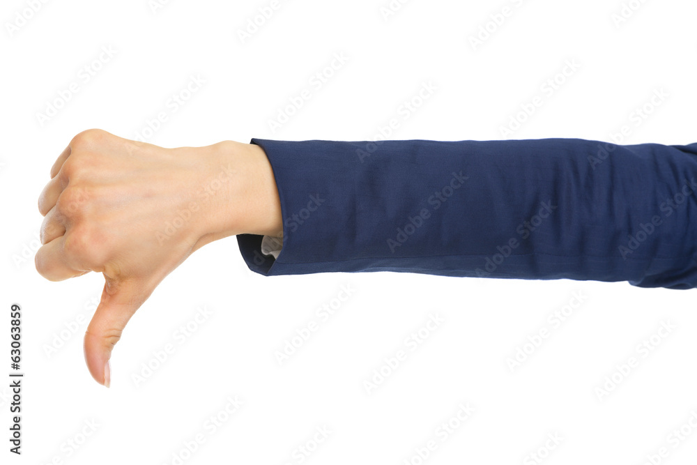 Closeup on business woman showing thumbs down Closeup on business woman showing thumbs down