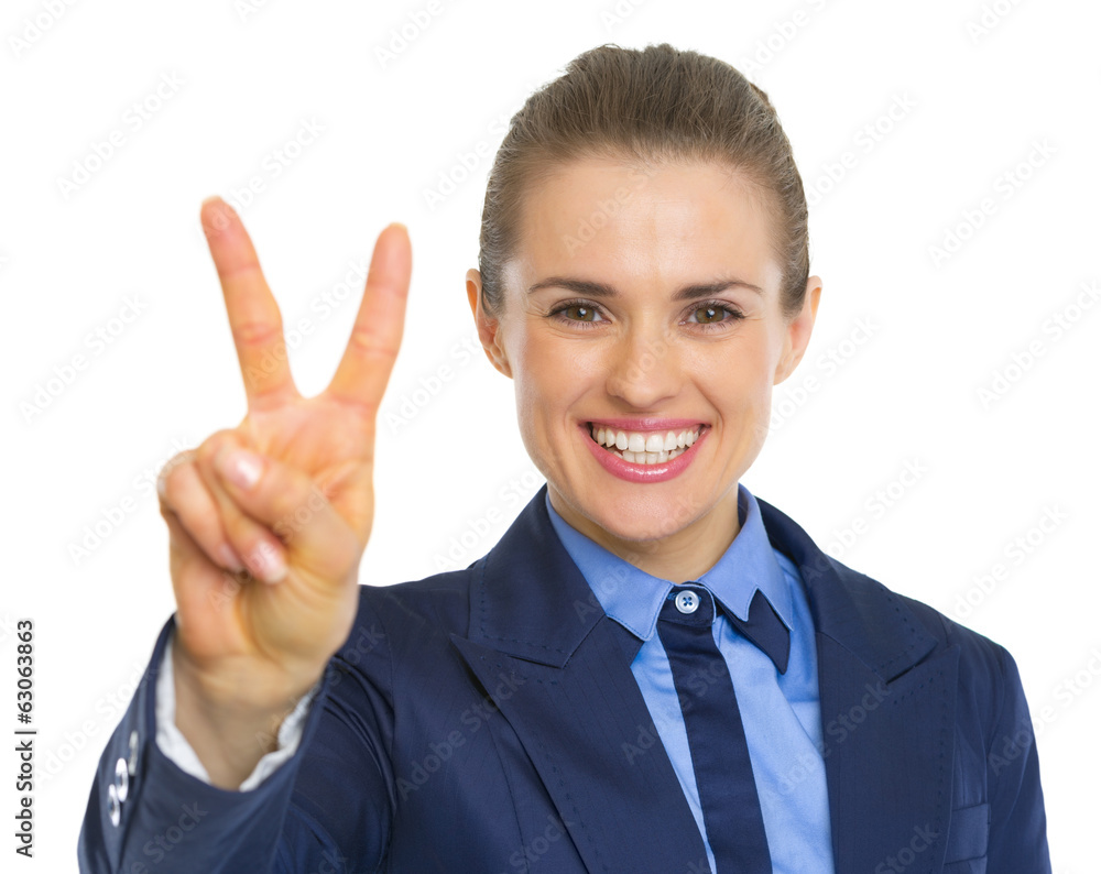 Happy business woman showing victory gesture Happy business woman showing victory gesture
