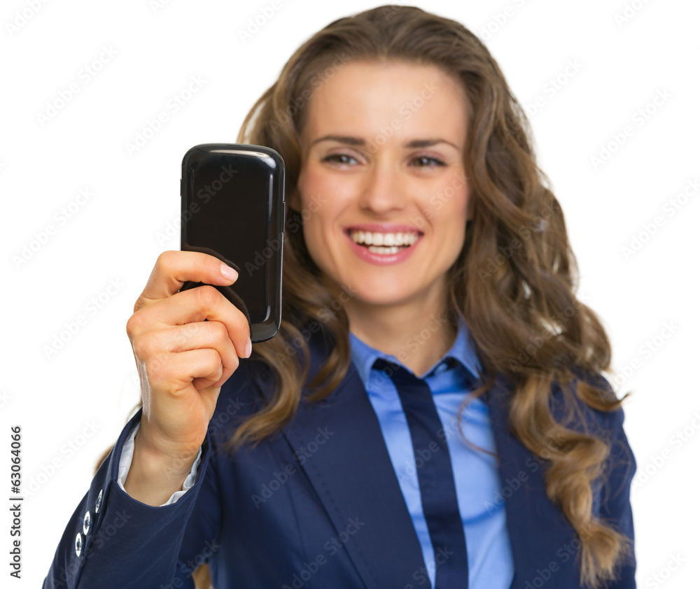 Portrait of smiling business woman taking photo with cell phone Portrait of smiling business woman taking photo with cell phone