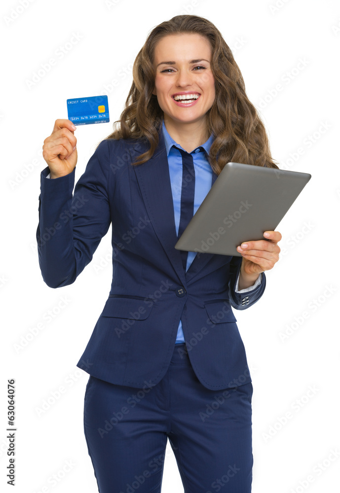 Business woman with tablet pc showing credit card Business woman with tablet pc showing credit card