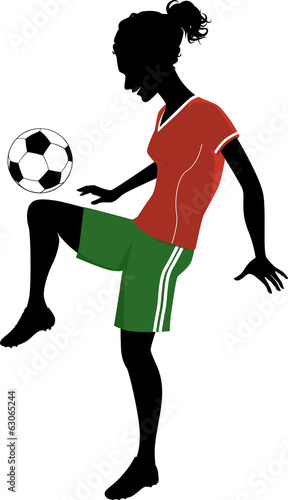 Fototapeta Naklejka Na Ścianę i Meble -  Silhouette of a teenage girl playing football or soccer