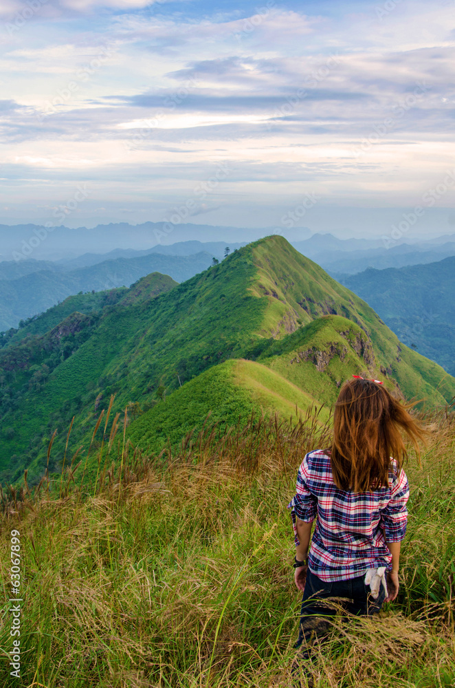 woman at the top of  (Khao Chang Puak) mountains in Thailand