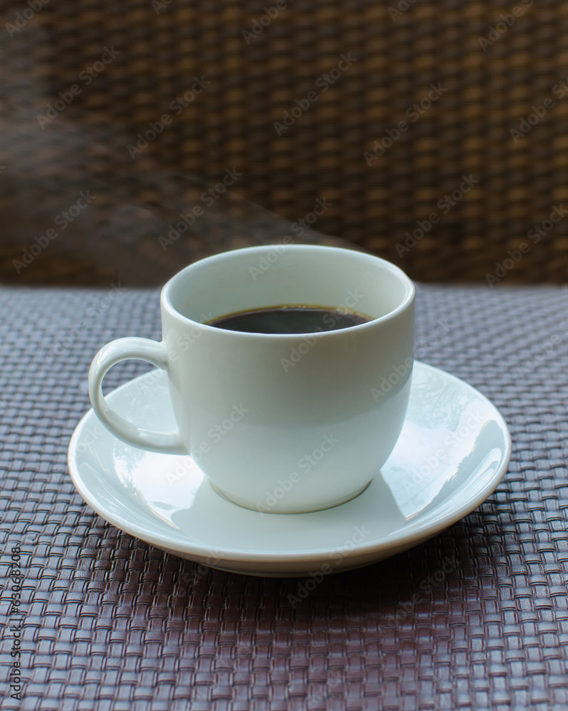 hot coffee on rattan table background hot coffee on rattan table background