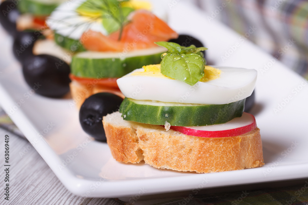 canape with boiled egg, cucumber, radish, basil. macro canape with boiled egg, cucumber, radish, basil. macro