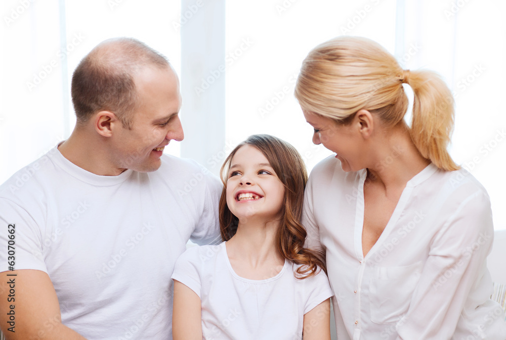 smiling parents and little girl at home smiling parents and little girl at home