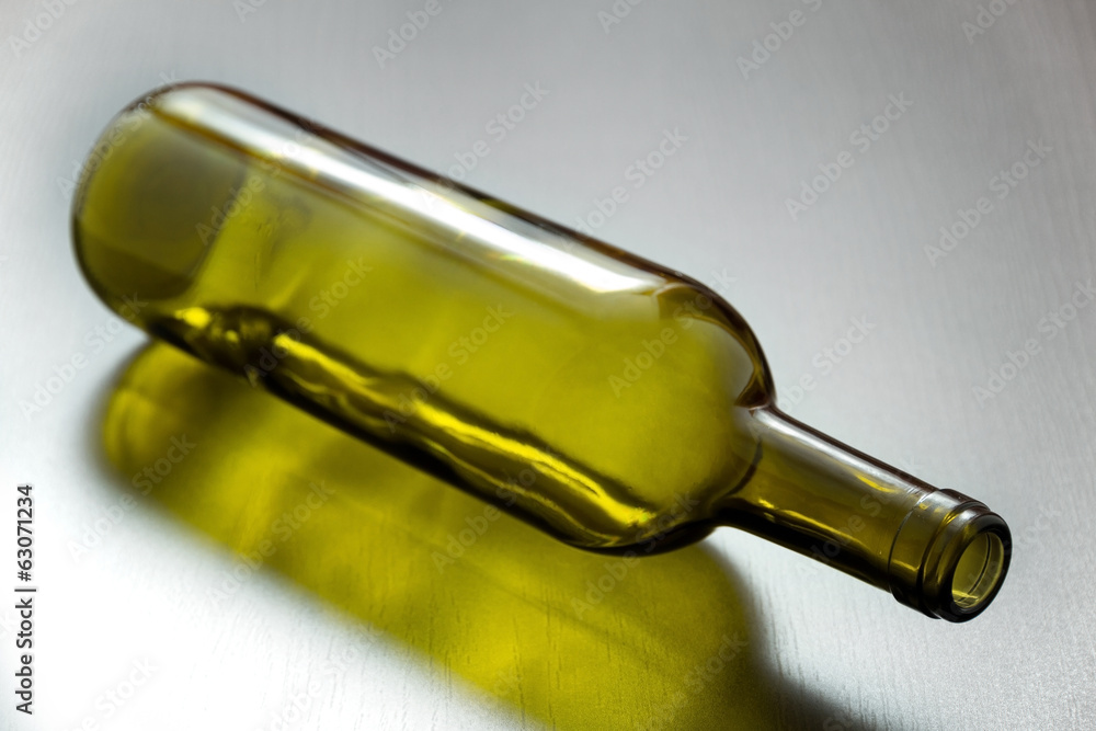 Fototapeta premium Green bottle on the table