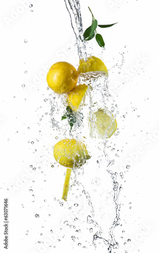 Pieces of lemons in water splash