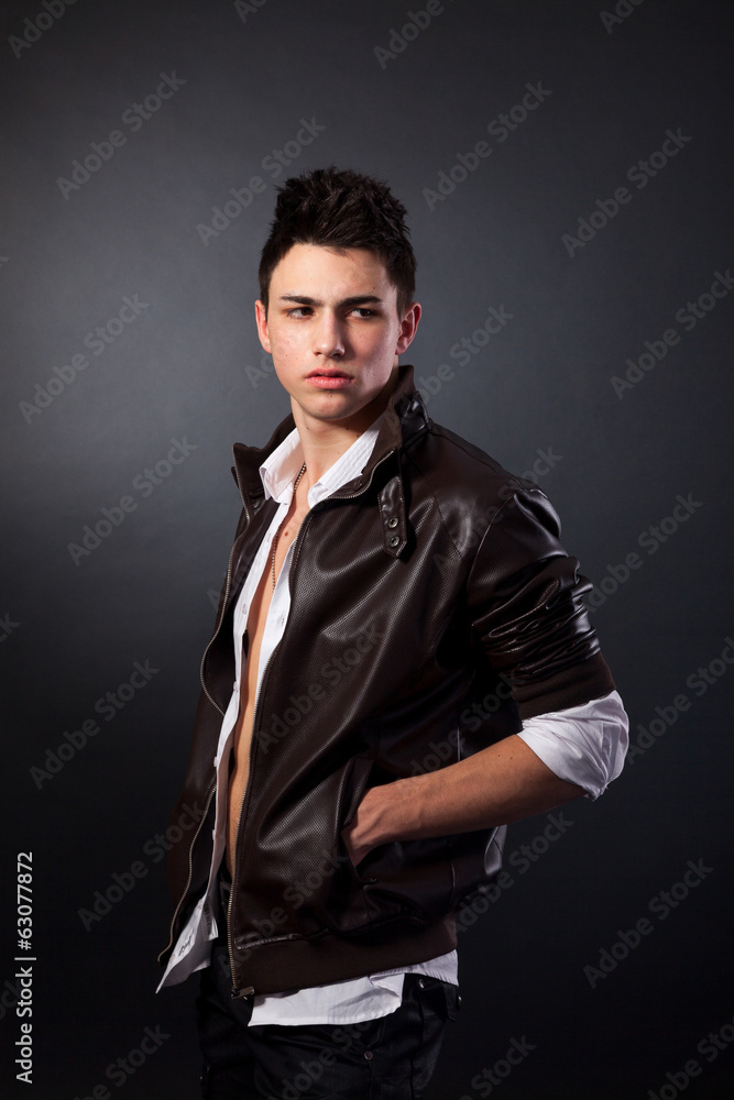 Fototapeta premium Healthy muscular young man on grey background