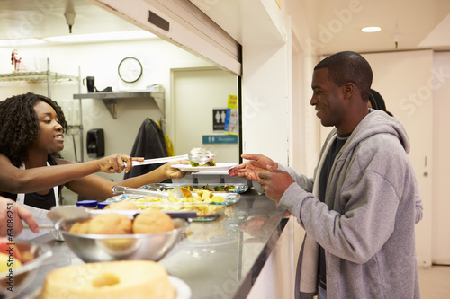 Kitchen Serving Food In Homeless Shelter