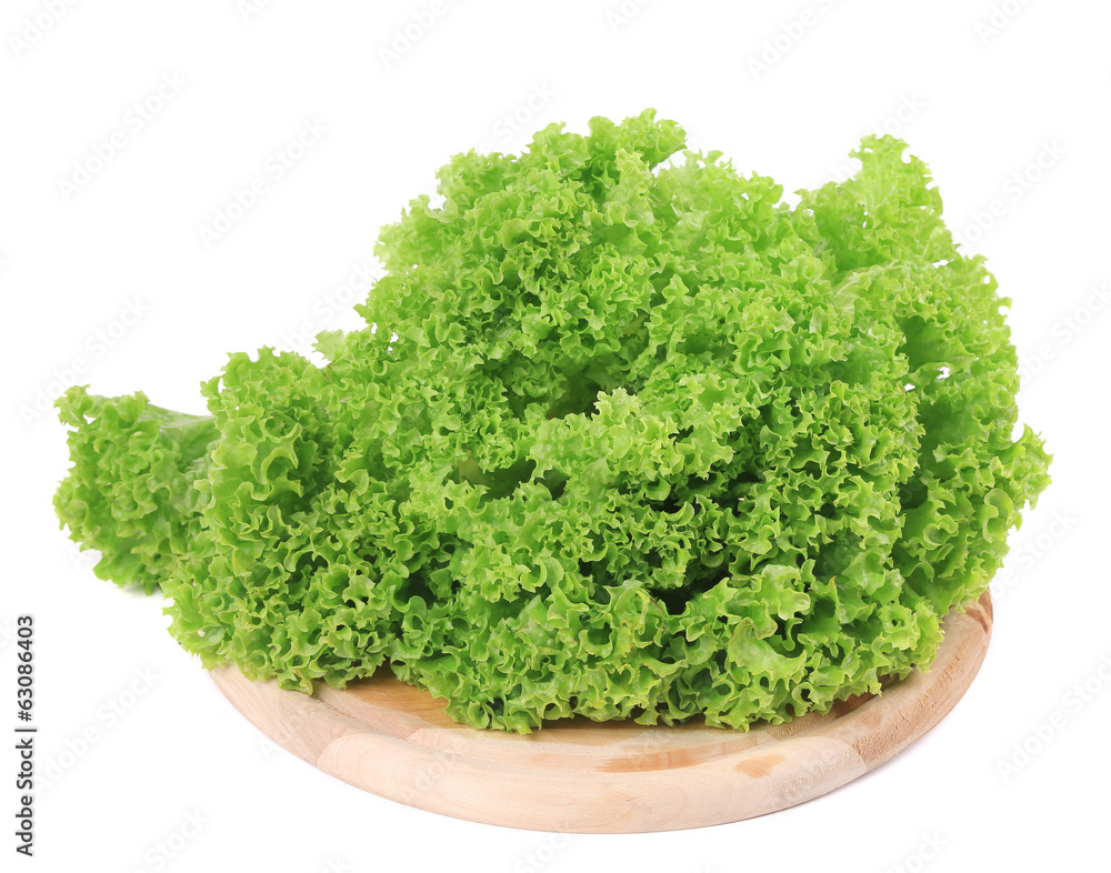 Fototapeta premium Fresh lettuce on wooden platter.