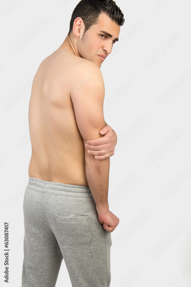 Muscular man with muscle pain