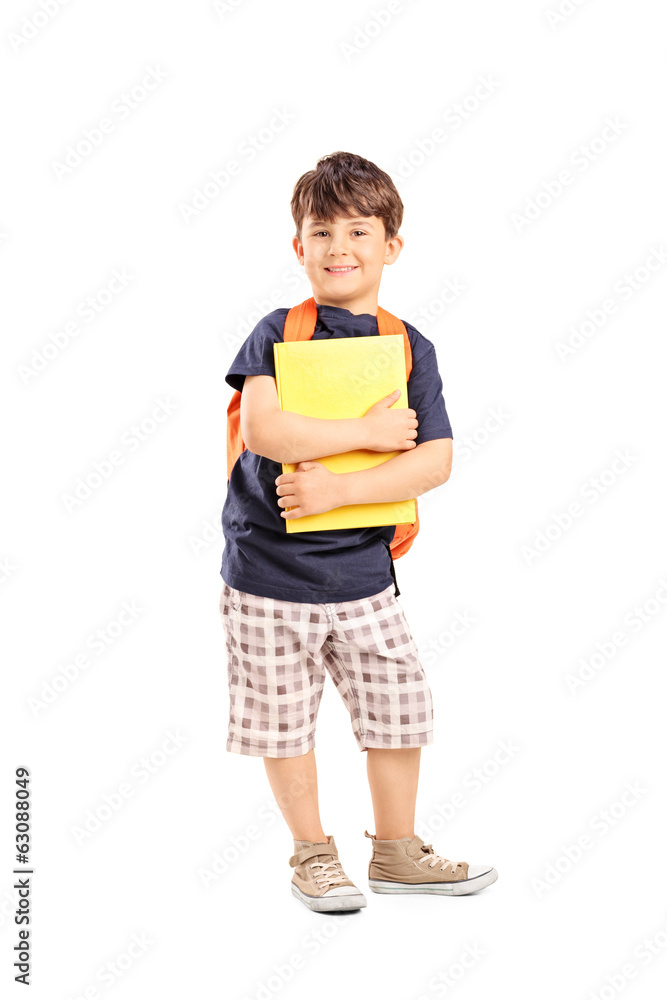 Schoolboy with backpack holding a notebook Schoolboy with backpack holding a notebook
