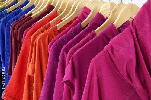 Variety of female colorful clothes on Hangers