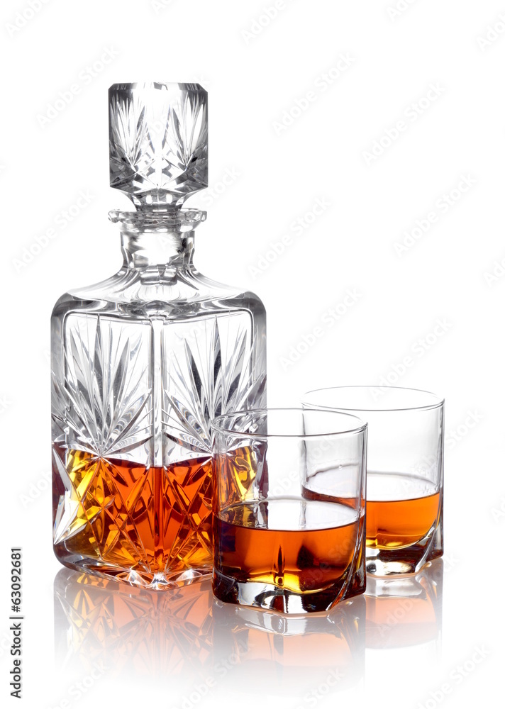 Whisky in a carafe and two glasses isolated on white Whisky in a carafe and two glasses isolated on white
