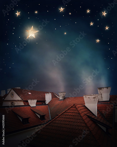 Rooftops and night sky photo