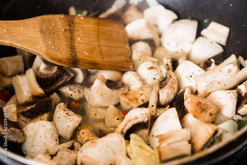 frying mushrooms in frying pan frying mushrooms in frying pan